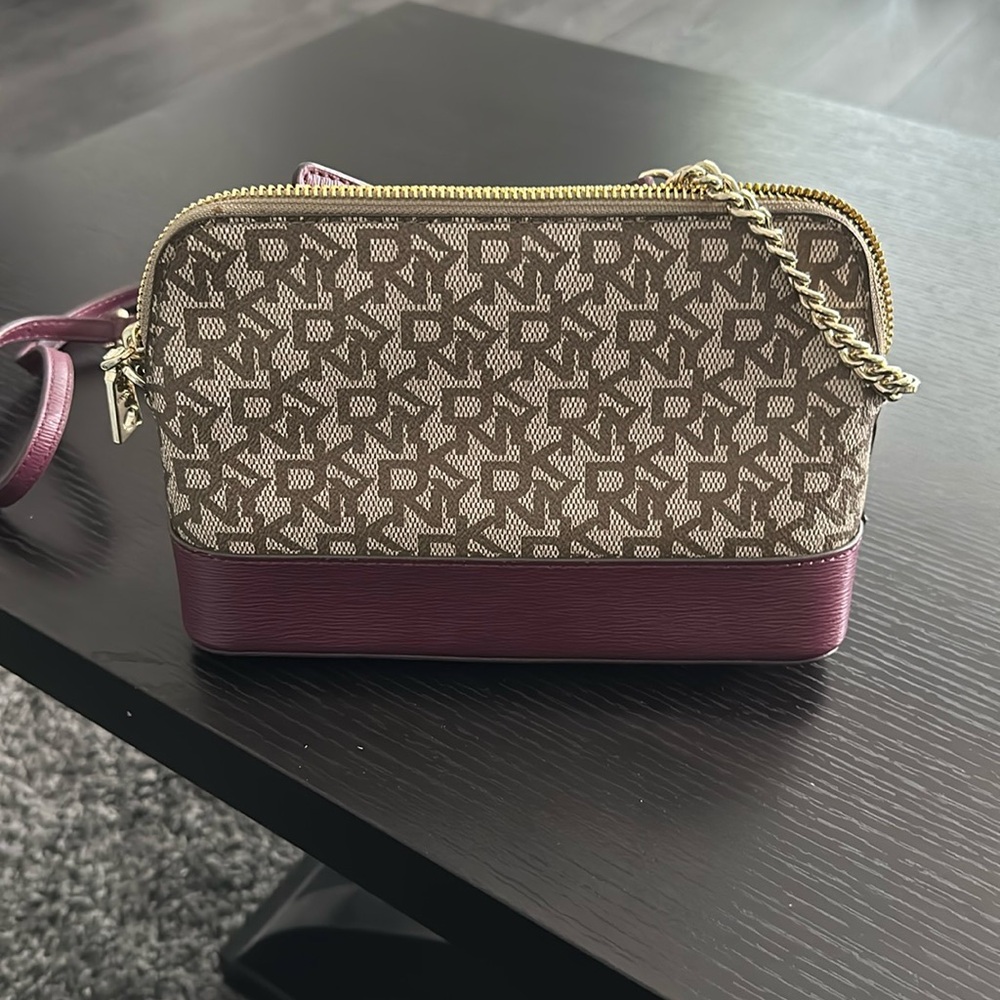 DNKY small crossbody purse in burgandy and signature “dnky” print.